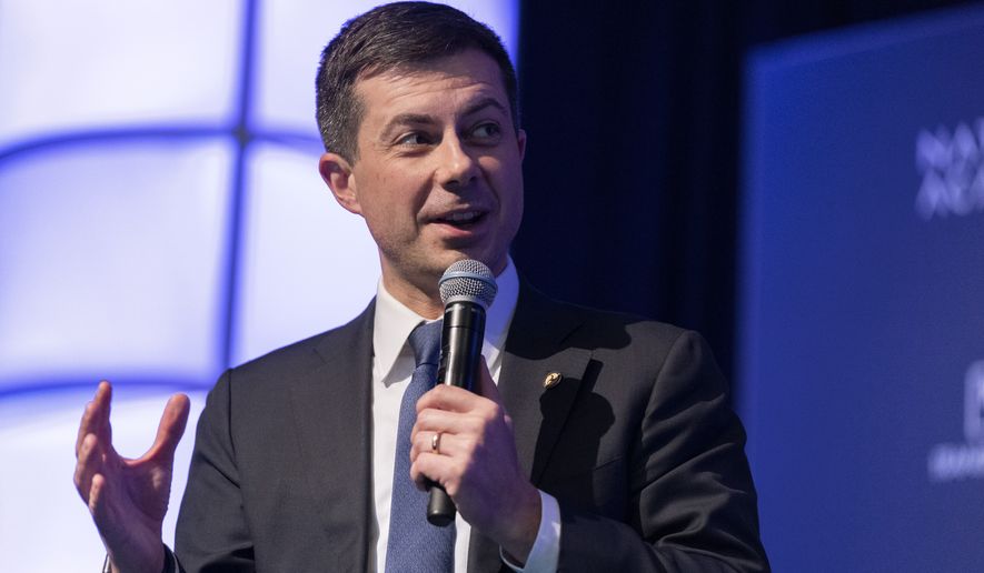 Transportation Secretary Pete Buttigieg, speaks to the Transportation Research Board gathering in Washington, Wednesday, Jan. 11, 2023. The world's largest aircraft fleet was grounded for hours by a cascading outage in a government system that delayed or canceled thousands of flights across the U.S. on Wednesday. (AP Photo/Manuel Balce Ceneta)