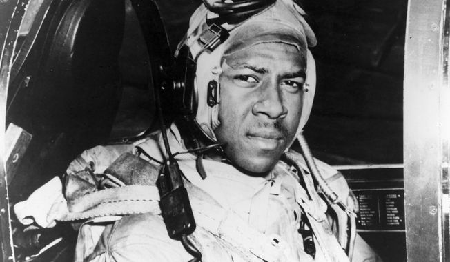 This circa 1950 photo provided by the U.S. Navy shows Jesse Brown in the cockpit of an F4U-4 Corsair fighter at an unidentified location. In December 2022, FedEx founder Fred Smith gifted the proceeds from the film “Devotion,” which he financed, that tells the story of groundbreaking Naval aviators Brown and Thomas Hudner. The proceeds will fund in part scholarships for the children of Navy service members studying STEM. (U.S Navy via AP, File)