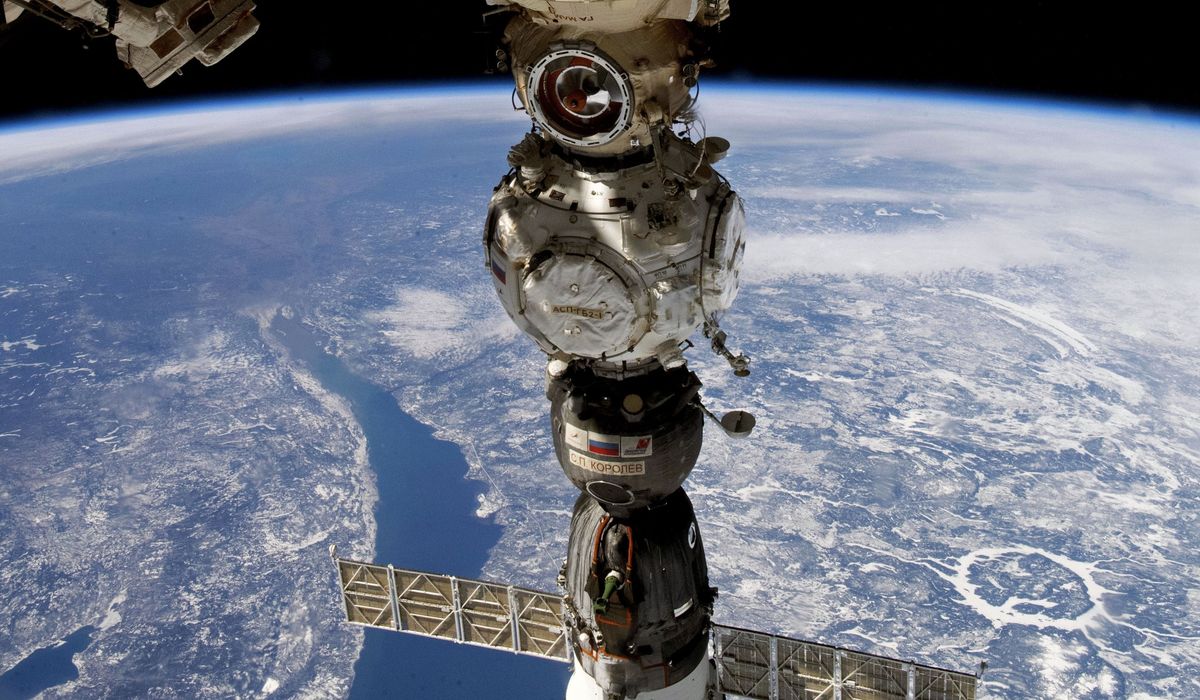 NextImg:Capsule carrying two Russians and an American heads to Earth from space station
