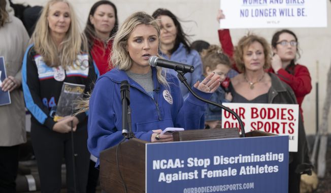 Former University of Kentucky swimmer Riley Gaines speaks at a rally on Thursday, Jan. 12, 2023, outside of the NCAA Convention in San Antonio. (AP Photo/Darren Abate)