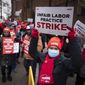 Protestors march on the streets around Montefiore Medical Center during a nursing strike, Wednesday, Jan. 11, 2023, in the Bronx borough of New York. (AP Photo/John Minchillo)