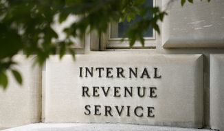 A sign outside the Internal Revenue Service building in Washington, on May 4, 2021. (AP Photo/Patrick Semansky, File)