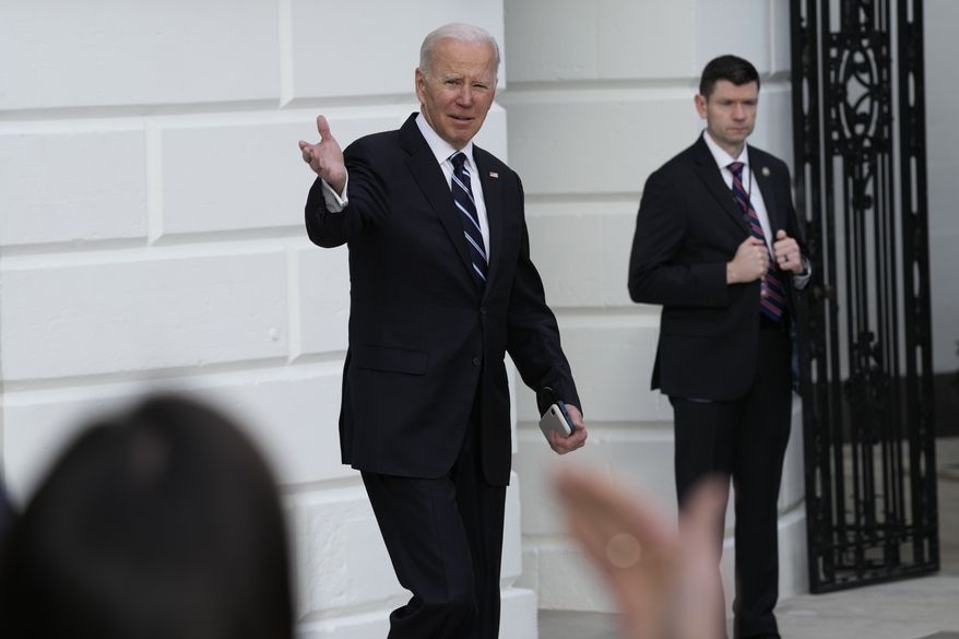 Reporters try to get the attention of President Joe Biden as walks out of the White House in Washington and heads towards Marine One on the South Lawn, Friday, Jan. 13, 2023. Biden is heading to Delaware for the weekend. (AP Photo/Susan Walsh)