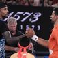Australia&#x27;s Nick Kyrgios, left, and Serbia&#x27;s Novak Djokovic shake hands following an exhibition match on Rod Laver Arena ahead of the Australian Open tennis championship in Melbourne, Australia, Friday, Jan. 13, 2023. (AP Photo/Mark Baker)