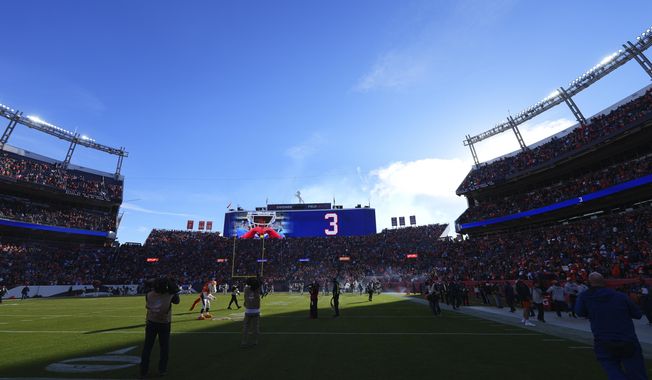 Buffalo Bills safety Damar Hamlin is honored before an NFL football game between the Denver Broncos and the Los Angeles Chargers in Denver, Sunday, Jan. 8, 2023. (AP Photo/Jack Dempsey)