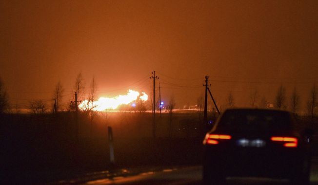 A flame rises after an explosion at a gas pipeline near Pasvalys, 175 km (109 miles) north of Vilnius in northern Lithuania on Friday, Jan. 13, 2023. Officials say an explosion has occurred in a pipeline in central Lithuania carrying natural gas to the north of the country and neighboring Latvia but no supply disruptions or injuries were reported. Baltic media reported that Friday&#x27;s blast sent flames up to 50 meters (164 feet) into the sky and forced the protective evacuation of a nearby village. (AP Photo/Paulius Zidonis)