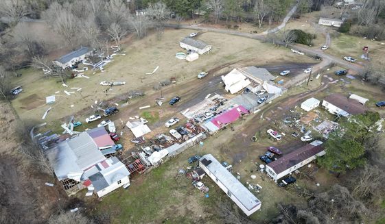 Devastation is seen in the aftermath from severe weather, Thursday, Jan. 12, 2023, in Moundville, Ala. A giant, swirling storm system billowing across the South spurred a tornado on Thursday that shredded the walls of homes, toppled roofs and uprooted trees. (Mike Goodall via AP)