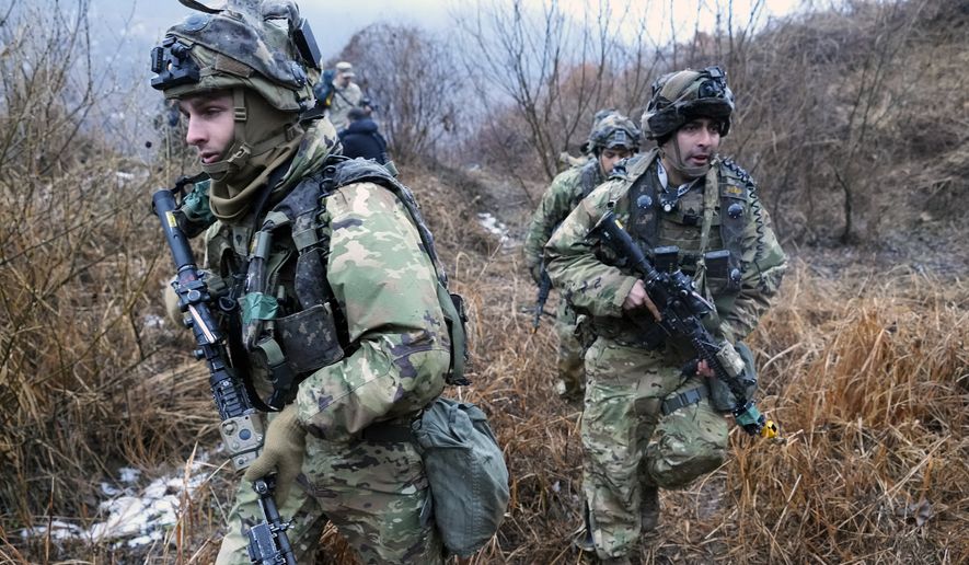 U.S. Army soldiers march during a joint military drill between South Korea and the United States in Paju, South Korea, Friday, Jan. 13, 2023. The drill involved the "Army Tiger Demonstration Brigade", which has been created to support South Korean Army's integration and use of Industry 4.0 technologies. (AP Photo/Ahn Young-joon) **FILE**