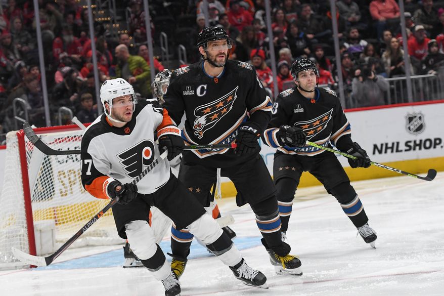 Washington Capitals left wing Alex Ovechkin (8) fighting for position in front of the net during the 2nd period in an NHL game against the Philadelphia Flyers at Capital One Arena in Washington D.C., January 14, 2023. (Photo by Billy Sabatini)