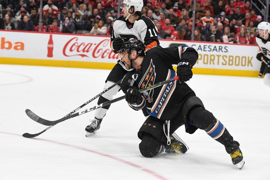 Washington Capitals left wing Alex Ovechkin (8) following through on a shot during the 2nd period in an NHL game against the Philadelphia Flyers at Capital One Arena in Washington D.C., January 14, 2023. (Photo by Billy Sabatini)