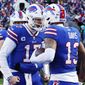 Buffalo Bills wide receiver Gabe Davis (13), right, is congratulated by quarterback Josh Allen after his touchdown catch during the second half of an NFL wild-card playoff football game against the Miami Dolphins, Sunday, Jan. 15, 2023, in Orchard Park, N.Y. (AP Photo/Jeffrey T. Barnes)