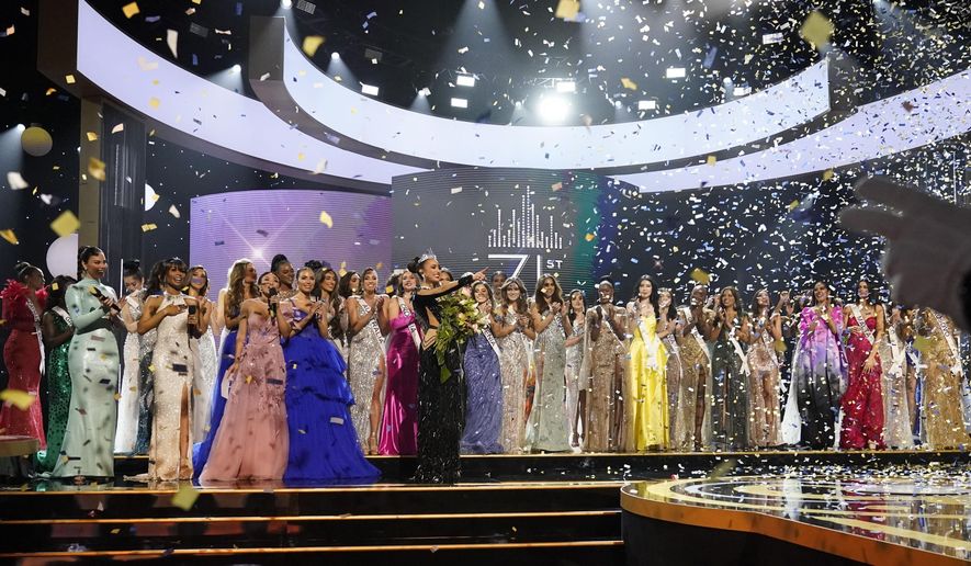 Miss USA R'Bonney Gabriel points on stage after being crowned Miss Universe at the 71st Miss Universe pageant, in New Orleans on Saturday, Jan. 14, 2023. (AP Photo/Gerald Herbert)