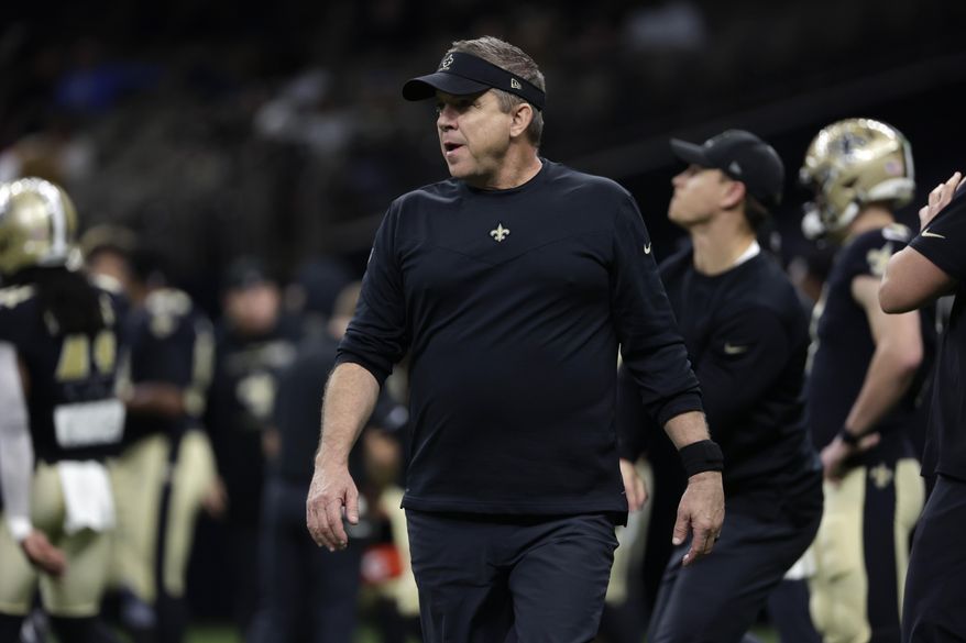 New Orleans Saints head coach Sean Payton walks on the field before an NFL football game against the Carolina Panthers in New Orleans, Jan. 2, 2022. The Carolina Panthers have received permission from the New Orleans Saints to interview Sean Payton for their vacant head coaching position, according to a person familiar with the situation. (AP Photo/Derick Hingle, File) **FILE**