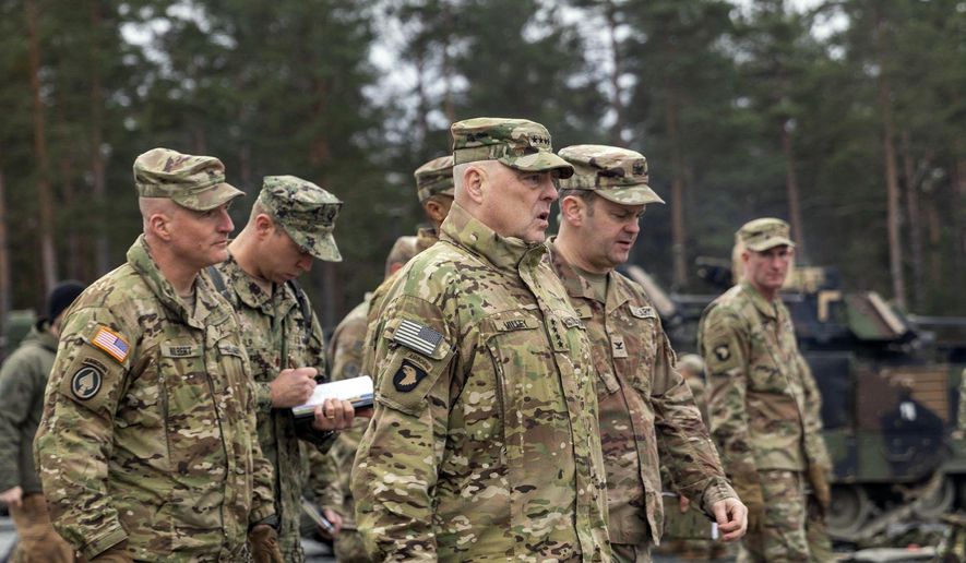 In this image provided by the U.S. Army, U.S. Chairman of the Joint Chiefs of Staff Gen. Mark A. Milley meets with U.S. Army leaders responsible for the collective training of Ukrainians at Grafenwoehr Training Area, Grafenwoehr, Germany, on Monday, Jan. 16, 2023. At left is Brig. Gen. Joseph E. Hilbert, who is the commanding general for the 7th Army Training Command. Milley visited the training site in Germany for Ukrainian forces and met with troops and commanders. (Staff Sgt. Jordan Sivayavirojna/U.S. Army via AP)