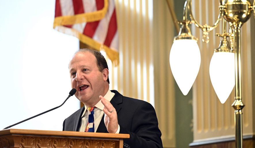 Colorado Governor Jared Polis delivers the 2023 State of the State address to a joint session of the legislature in the House of Representatives chamber in the State Capitol Tuesday, Jan. 17, 2023, in Denver. (RJ Sangosti/The Denver Post via AP)