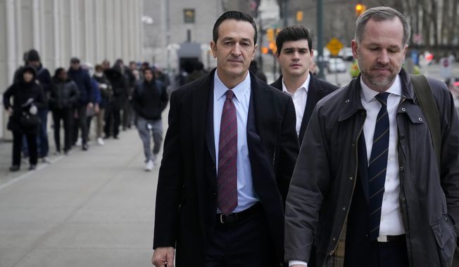 Former 21st Century Fox executive Hernan Lopez, left,wld arrives to Federal court in Brooklyn, Tuesday, Jan. 17, 2023, in New York. (AP Photo/John Minchillo)