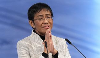 Nobel Peace Prize winner Maria Ressa of the Philippines gestures as she speaks during the Nobel Peace Prize ceremony at Oslo City Hall, Norway on Dec. 10, 2021. A Philippine tax court on Wednesday, Jan. 18, 2023, cleared Ressa and her online news company of tax evasion charges she said were part of a slew of legal cases used by former President Rodrigo Duterte to muzzle critical reporting. (AP Photo/Alexander Zemlianichenko, File)