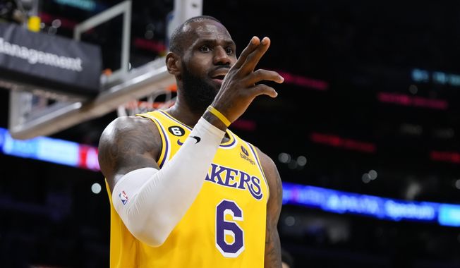 Los Angeles Lakers&#x27; LeBron James (6) reacts after making a basket and drawing a foul during the first half of an NBA basketball game against the Houston Rockets, Monday, Jan. 16, 2023, in Los Angeles. (AP Photo/Jae C. Hong)