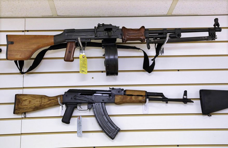 Assault weapons are seen for sale at Capitol City Arms Supply on Jan. 16, 2013 in Springfield, Ill. Legal challenges to Illinois' semiautomatic weapons ban began Wednesday, Jan. 18, 2023, with a federal complaint that the eight-day-old law prohibits “commonly possessed” and constitutionally protected guns and a state court pleading questioning the law's exemptions based on a person's employment. (AP Photo/Seth Perlman, File)