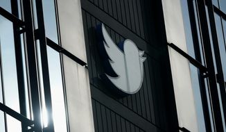 A Twitter logo hangs outside the company&#39;s offices in San Francisco, on Dec. 19, 2022.  (AP Photo/Jeff Chiu, File)