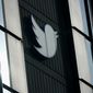 A Twitter logo hangs outside the company&#39;s offices in San Francisco, on Dec. 19, 2022.  (AP Photo/Jeff Chiu, File)