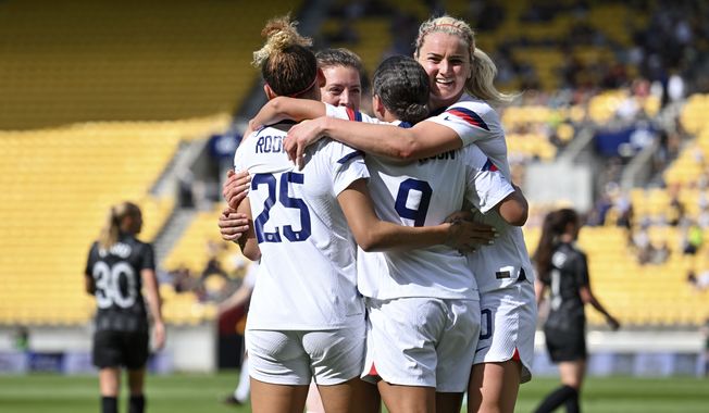 Players from the U.S. celebrate a goal against New Zealand during their women&#x27;s international soccer friendly game in Wellington, New Zealand, Wednesday, Jan. 18, 2023. (Mark Tantrum/Photosport via AP)