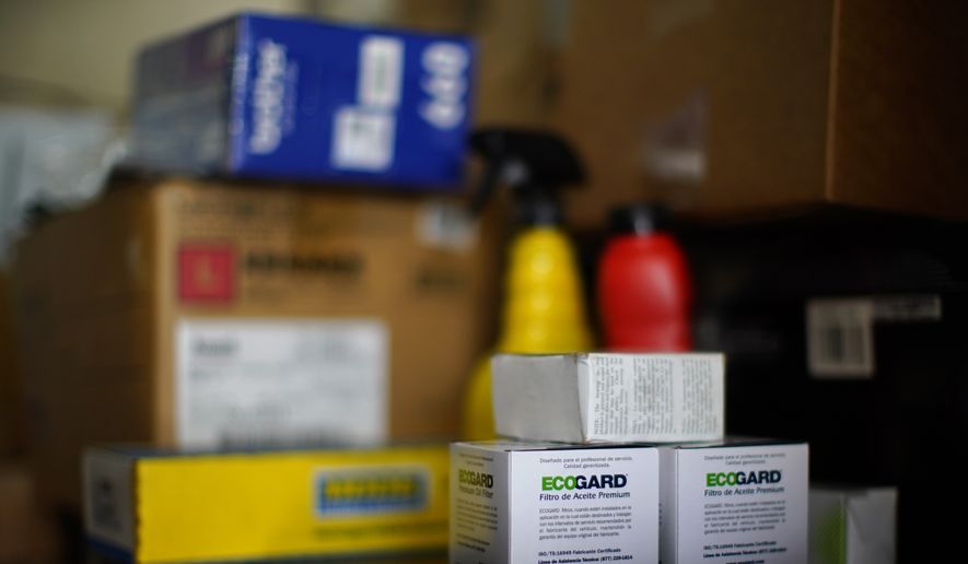 Auto parts are displayed on a shelf at a car repair shop, Wednesday, July 13, 2022, in Collingdale, Pa. On Wednesday, the Labor Department releases the Producer Price Index for December. (AP Photo/Matt Slocum, File)