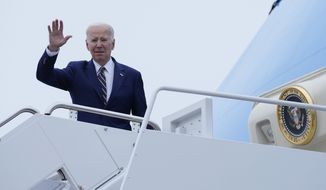 President Joe Biden salutes at the top of the steps before boarding Air Force One at Andrews Air Force Base, Md., Thursday, Jan. 19, 2023. Biden is traveling to California to survey weather damage. (AP Photo/Susan Walsh)