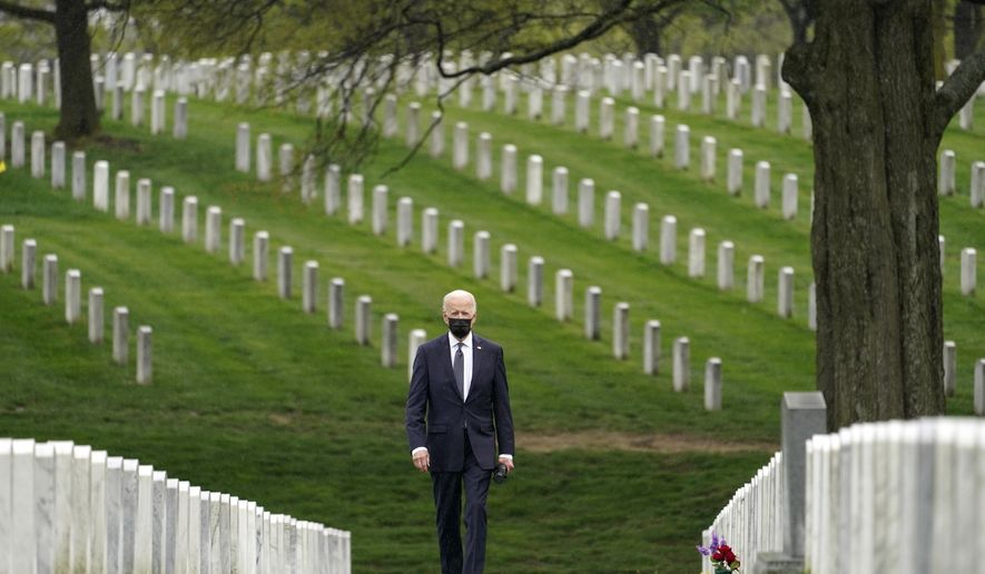 President Joe Biden visits Section 60 of Arlington National Cemetery in Arlington, Va., on April 14, 2021. Biden announced the withdrawal of the remainder of U.S. troops from Afghanistan by Sept. 11, 2021, the 20th anniversary of the terrorist attacks on America. (AP Photo/Andrew Harnik, File)