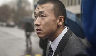 NYPD officer Baimadajie Angwang, a naturalized US citizen from Tibet, speaks during a press briefing outside Brooklyn&#39;s Federal court after a judge dismissed spy charges against him, Thursday Jan. 19, 2023, in New York. U.S. prosecutors dropped charges against Angwang, who authorities had initially accused of spying on independence-minded Tibetans on behalf of the Chinese consulate in New York. (AP Photo/Bebeto Matthews)