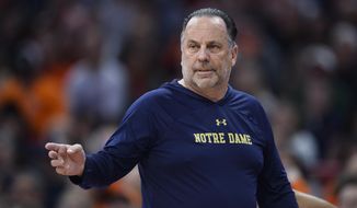 Notre Dame head coach Mike Brey directs players during the first half of the team&#39;s NCAA college basketball game against Syracuse in Syracuse, N.Y., Saturday, Jan. 14, 2023. (AP Photo/Adrian Kraus) **FILE**