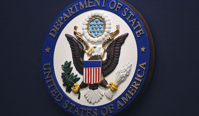 The State Department seal is seen on the briefing room lectern at the State Department in Washington, Jan. 31, 2022. (Mandel Ngan, Pool via AP, File)