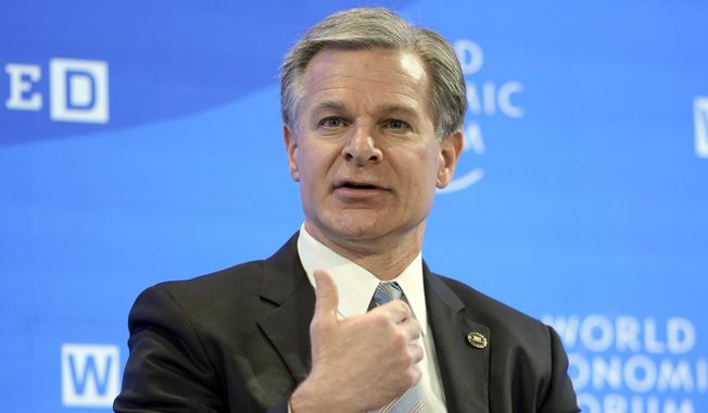 FBI Director Christopher Wray talks at the World Economic Forum in Davos, Switzerland Thursday, Jan. 19, 2023. The annual meeting of the World Economic Forum is taking place in Davos from Jan. 16 until Jan. 20, 2023. (AP Photo/Markus Schreiber)