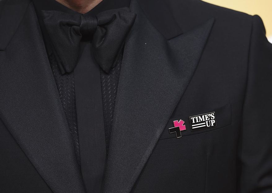 FILE - Edgar Ramirez wear's a Time's Up pin arrives at the 75th annual Golden Globe Awards at the Beverly Hilton Hotel on Jan. 7, 2018, in Beverly Hills, Calif. Five years after making its public debut, the #MeToo-era's Time's Up organization is ceasing operations and shifting funds to its legal defense fund, according to the group’s board chair in an interview with The Associated Press, Friday, Jan. 20, 2023. (Photo by Jordan Strauss/Invision/AP, File)