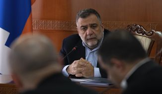 Ruben Vardanyan, the State Minister of Nagorno-Karabakh, also known as Artsakh leads a cabinet meeting in Stepanakert, the capital of the separatist region of Nagorno-Karabakh, also known as Artsakh, on Tuesday, Jan. 3, 2023. Protesters claiming to be ecological activists have blocked the only road leading from Armenia to Nagorno-Karabakh for more than a month, leading to increasing food shortages. Vardanyan thanked all the deputies of the European Parliament, referring to their discussions on the rights of the people and the resolution adopted as a result. (Edgar Harutyunyan/PAN Photo via AP)