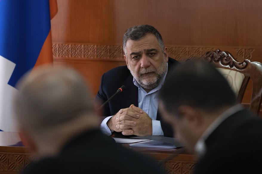 Ruben Vardanyan, the State Minister of Nagorno-Karabakh, also known as Artsakh leads a cabinet meeting in Stepanakert, the capital of the separatist region of Nagorno-Karabakh, also known as Artsakh, on Tuesday, Jan. 3, 2023. Protesters claiming to be ecological activists have blocked the only road leading from Armenia to Nagorno-Karabakh for more than a month, leading to increasing food shortages. Vardanyan thanked all the deputies of the European Parliament, referring to their discussions on the rights of the people and the resolution adopted as a result. (Edgar Harutyunyan/PAN Photo via AP)