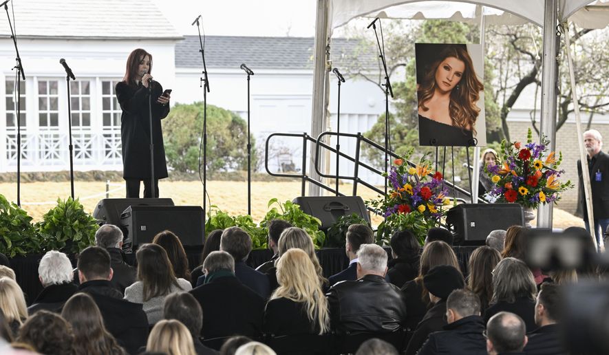 Priscilla Presley reads a poem wrtitten by granddaughter Harper Lockwood during a memorial service for her daughter Lisa Marie Presley at Graceland Sunday, Jan. 22, 2023, in Memphis, Tenn. Lisa Marie died Jan. 12 after being hospitalized for a medical emergency and was buried on the property next to her son Benjamin Keough, and near her father Elvis Presley and his two parents. (AP Photo/John Amis)