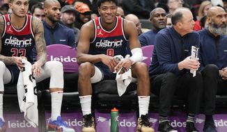 Washington Wizards forward Rui Hachimura (8) smiles while sitting on the bench during the second half of an NBA basketball game against the Orlando Magic, Saturday, Jan. 21, 2023, in Washington. The Wizards won 138-118 and Hachimura scored a career-tying 30 points. (AP Photo/Jess Rapfogel)