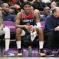 Washington Wizards forward Rui Hachimura (8) smiles while sitting on the bench during the second half of an NBA basketball game against the Orlando Magic, Saturday, Jan. 21, 2023, in Washington. The Wizards won 138-118 and Hachimura scored a career-tying 30 points. (AP Photo/Jess Rapfogel)