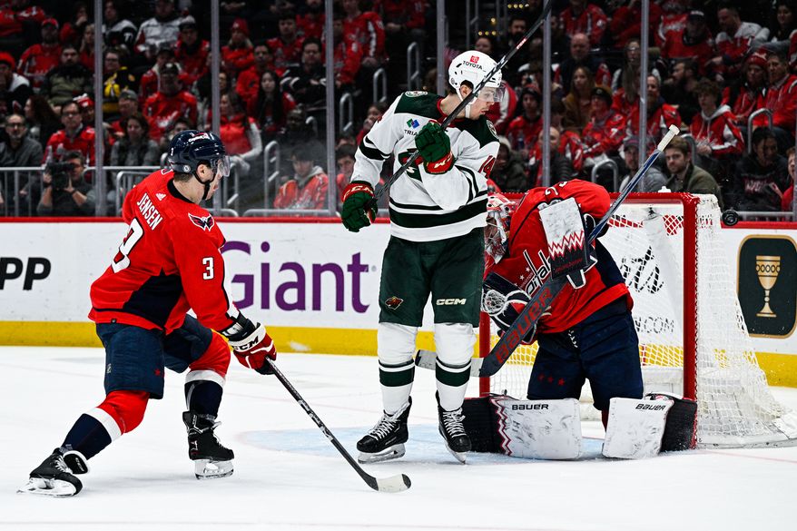 Washington Capitals goalie Charlie Lindgren (79) deflects the puck away against the Minnesota Wild at Capital One Arena, Washington, D.C., January 17, 2023. (Photo by Brian Murphy)