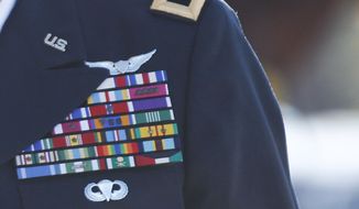 The roughly 900 generals and admirals on active duty today is far fewer than it was in past eras, but the percentage of those officers compared with the number of enlisted troops is near the highest level in modern military history, according to Congressional Research Service data. (Associated Press)
