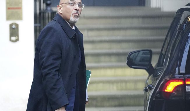 Britain&#x27;s Conservative Party Chairman Nadhim Zahawi arrives at the Conservative Party head office in Westminster, central London, Monday, Jan. 23, 2023. The chairman of Britain’s governing Conservative Party was under pressure to resign on Monday over allegations he settled a multimillion-dollar unpaid tax bill while he was in charge of the country’s Treasury. (James Manning/PA via AP)