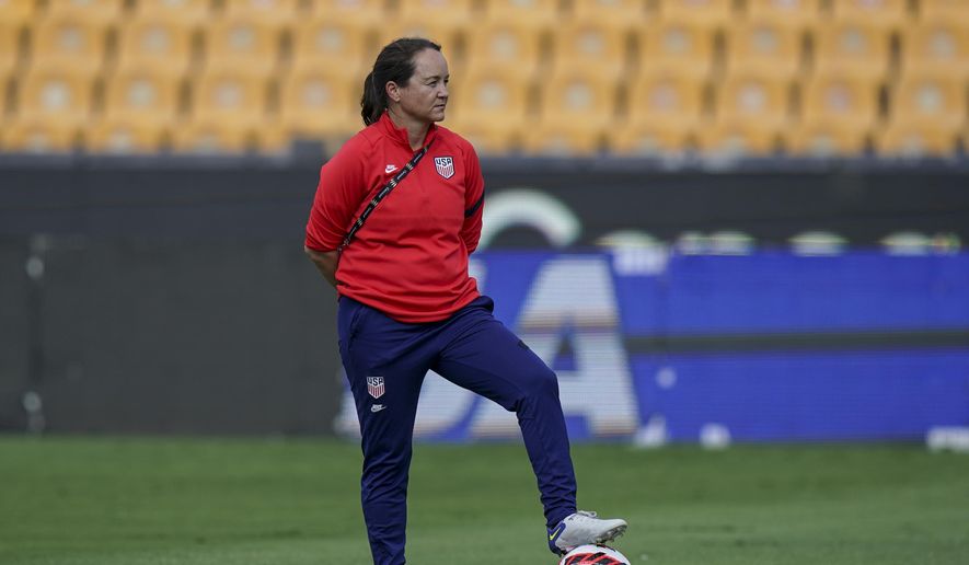 Twila Kilgore, assistant coach on the U.S. team watches players warm up prior to a CONCACAF Women&#x27;s Championship soccer semifinal match against Costa Rica in Monterrey, Mexico, Thursday, July 14, 2022. Kilgore, is an assistant for the U.S. women’s national team and one of just four women in the United States who hold the U.S. Soccer Federation’s elite pro license.(AP Photo/Fernando Llano, File) **FILE**