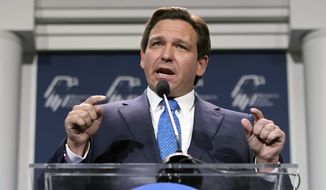 FILE - Florida Gov. Ron DeSantis speaks at an annual leadership meeting of the Republican Jewish Coalition on Nov. 19, 2022, in Las Vegas. DeSantis reiterated Monday, Jan. 23, 2023, that the state&#x27;s rejection of a proposed nationwide advanced African American studies course, saying it pushes a political agenda — something three authors cited in the state&#x27;s criticism accused him of doing in return. (AP Photo/John Locher, File)