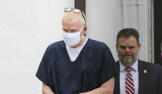 Alex Murdaugh is escorted out of the Colleton County Courthouse in Walterboro, S.C., on July 20, 2022. Murdaugh&#x27;s trial on two counts of murder in the June 2021 deaths of his wife and son is scheduled to start Monday, Jan. 23, 2023. (Tracy Glantz/The State via AP, File)