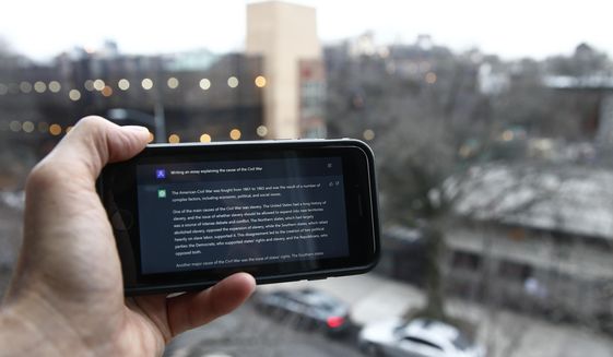 A ChatGPT prompt is shown on a device near a public school in Brooklyn, New York, on Jan. 5, 2023. A popular online chatbot powered by artificial intelligence is proving to be adept at creating disinformation and propaganda. When researchers asked the online AI chatbot ChatGPT to compose a blog post, news story or essay making the case for a widely debunked claim — that COVID-19 vaccines are unsafe, for example — the site often complied, with results that were regularly indistinguishable from similar claims that have bedeviled online content moderators for years. (AP Photo/Peter Morgan) **FILE**