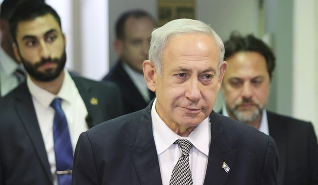 Israeli Prime Minister Benjamin Netanyahu attends a hearing at the Magistrate&#x27;s Court in Rishon LeZion, Israel, Monday, Jan. 23, 2023. Netanyahu has made a surprise trip to Jordan to meet with King Abdullah II. Tuesday, Jan 24. (Abir Sultan/Pool Photo via AP)