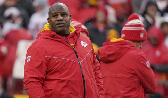 Kansas City Chiefs offensive coach Eric Bieniemy watches warms up prior prior to an NFL Divisional Playoff football game against the Jacksonville Jaguars Saturday, Jan. 21, 2023, in Kansas City, Mo. (AP Photo/Ed Zurga) **FILE**