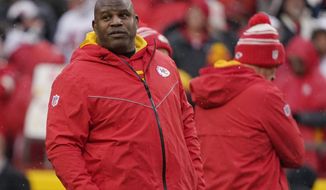 Kansas City Chiefs offensive coach Eric Bieniemy watches warms up prior prior to an NFL Divisional Playoff football game against the Jacksonville Jaguars Saturday, Jan. 21, 2023, in Kansas City, Mo. (AP Photo/Ed Zurga)