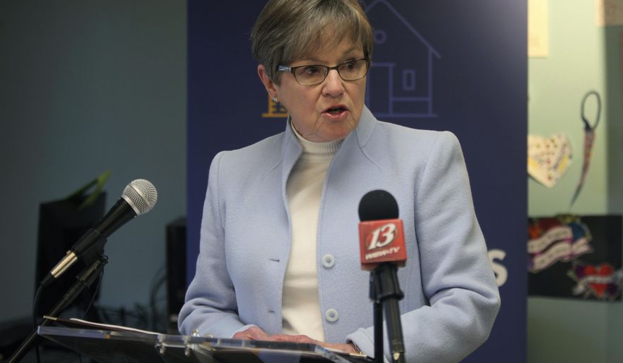 Kansas Gov. Laura Kelly speaks during a news conference at the YWCA Center for Safety and Empowerment Day Center about her proposals for cutting taxes, Monday, Jan. 23, 2023, in Topeka, Kansas. The Democratic governor is preparing to give the annual State of the State address to a skeptical, Republican-controlled Legislature that has different ideas about how to cut taxes. (AP Photo/John Hanna)